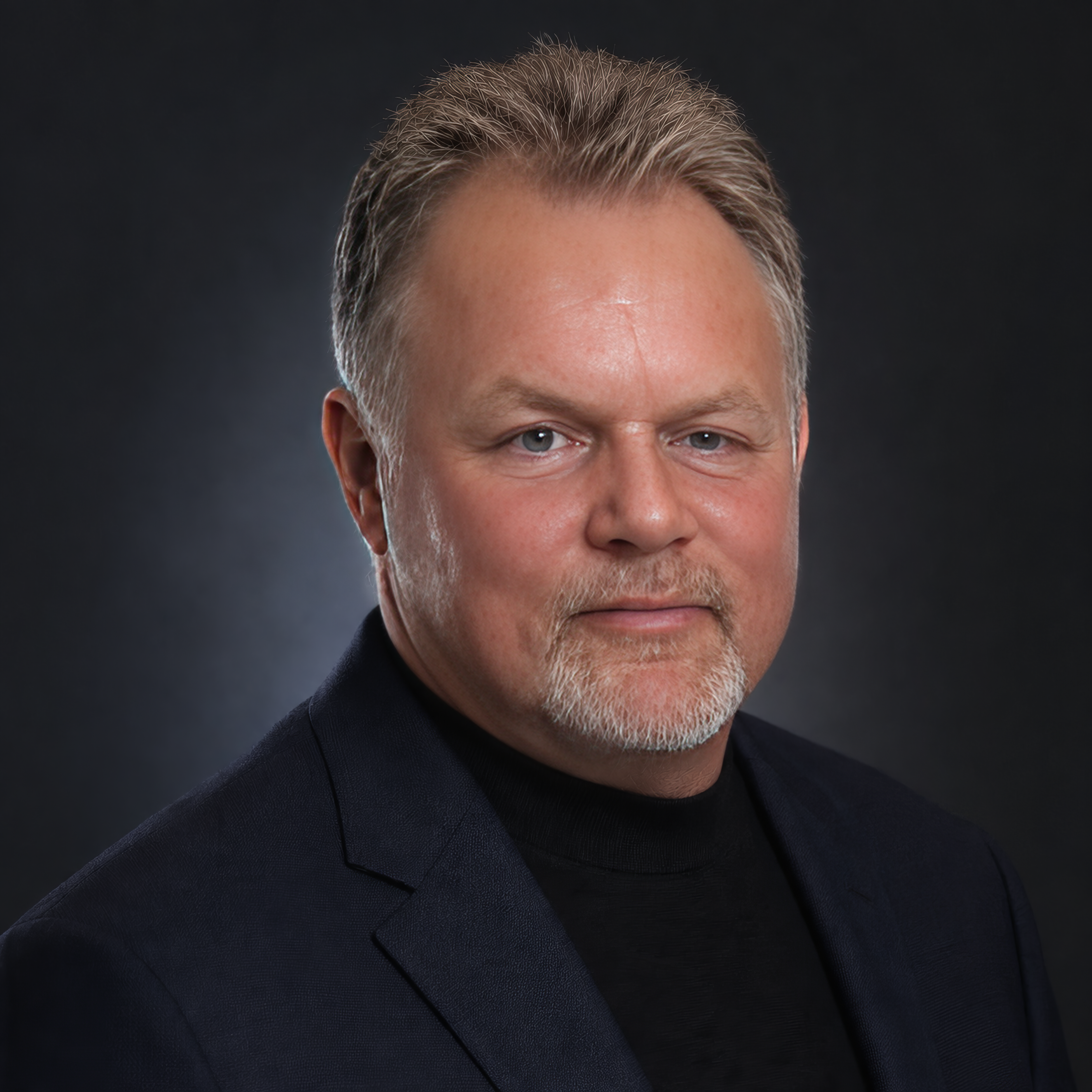 Portrait of Scott Kerr in a studio setting