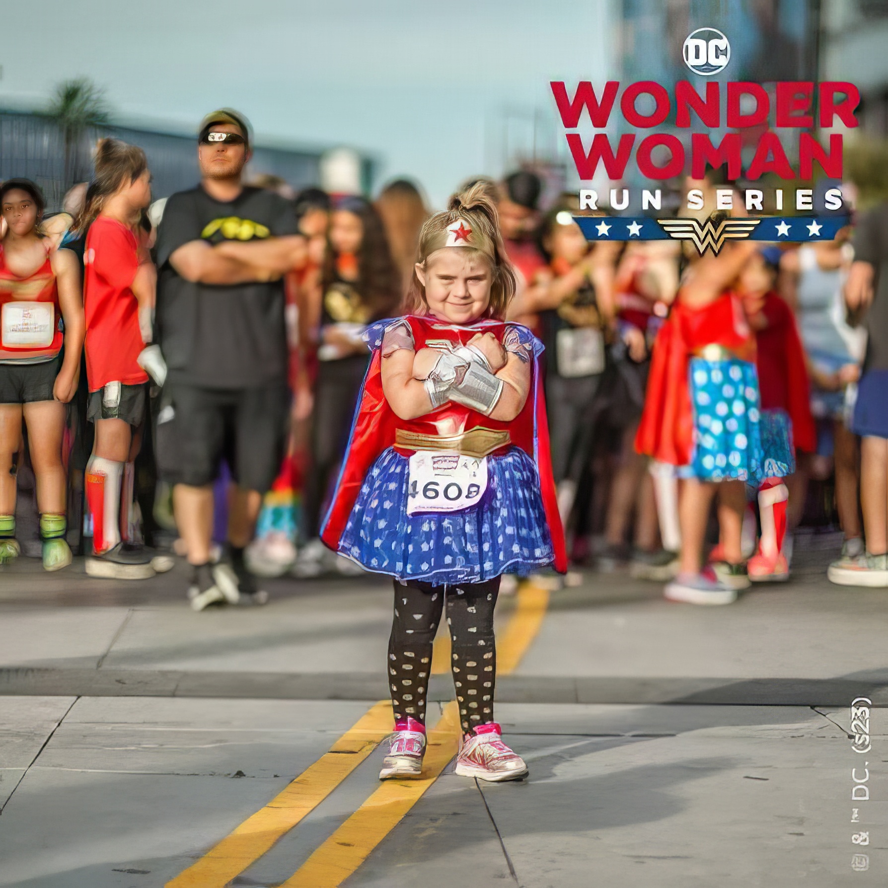 Young Wonder Woman runner at the finish area